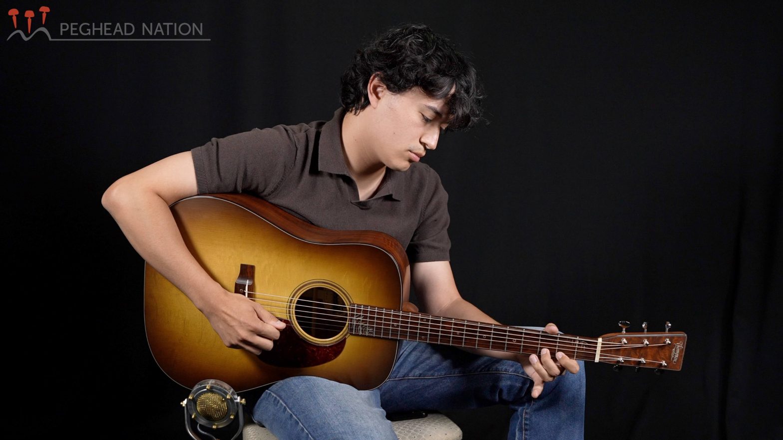 Ian Ly playing the Thompson Molly Tuttle Signature Model guitar